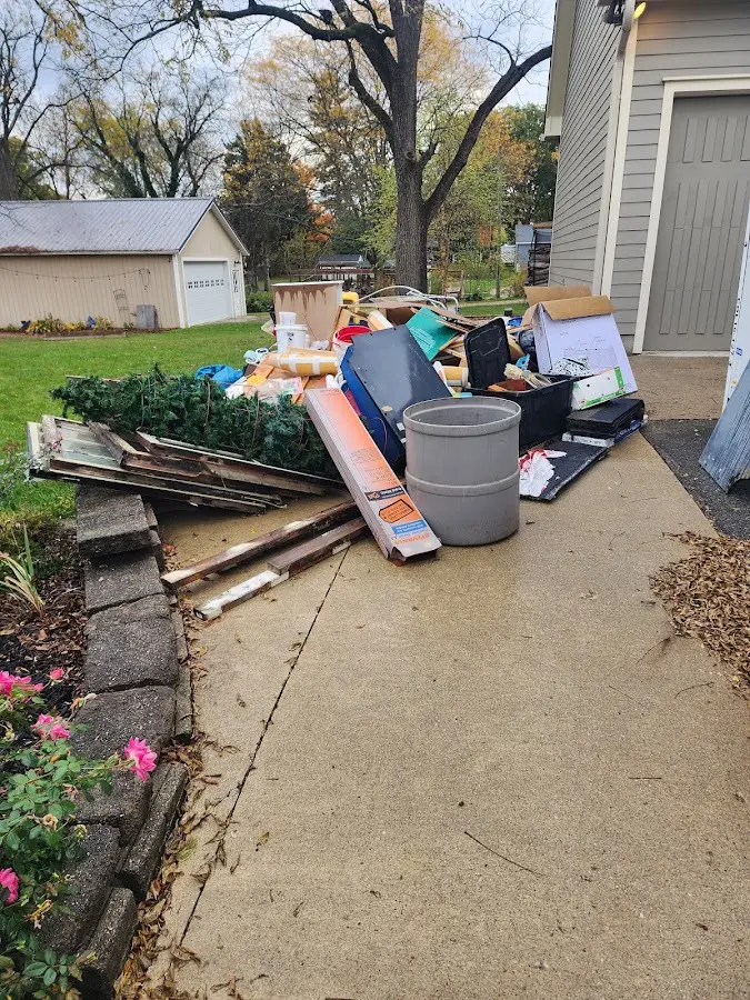 Dumpster being loaded with debris for Estate Cleanout Dumpster Rental in Clearfield